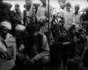 Men chat in a refugee camp outside the city of Herat close to the Iranian border on June 3, 2007 in Afghanistan. 